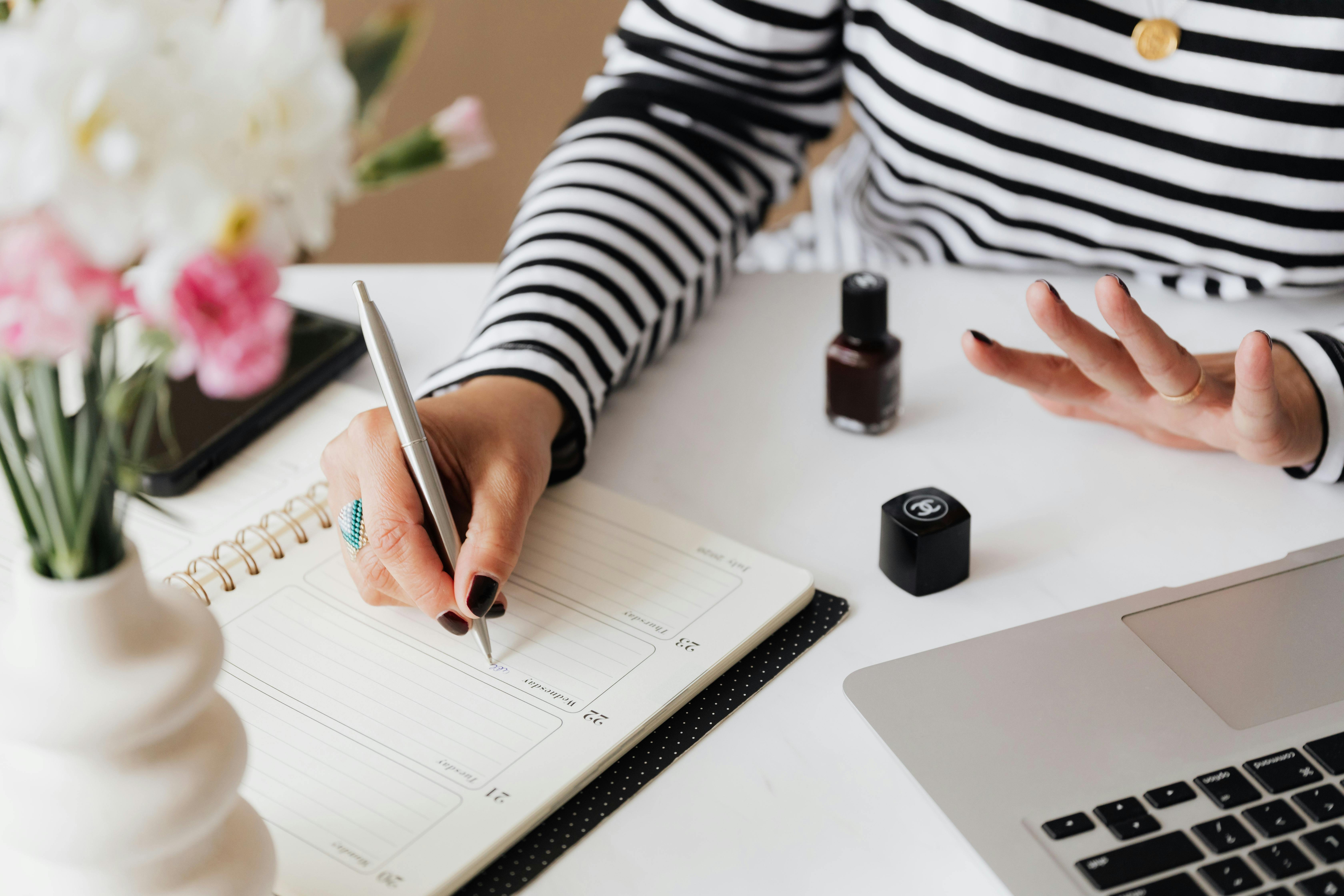 Person writing notes for a business or marketing plan